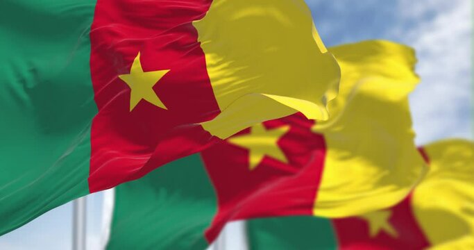 Three Cameroon national flags waving in the wind