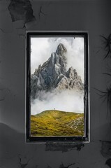 the window is open revealing a picture of a mountain range
