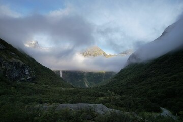The shy moutain hides in the clouds