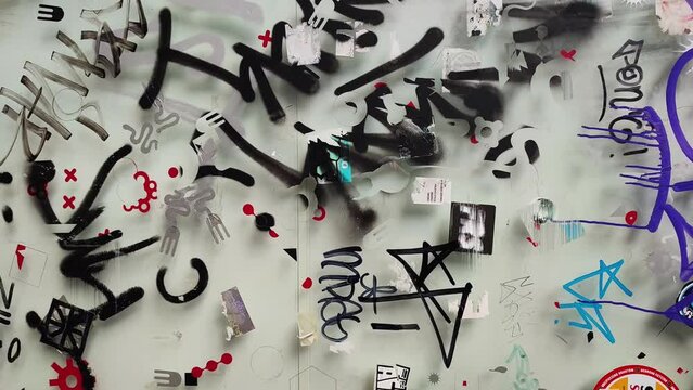 Stop motion animated ripped torn paper street posters. Urban textures. Graffiti on brick and concrete walls. Abstract grunge texture. Stop motion video animation. Hip Hop style