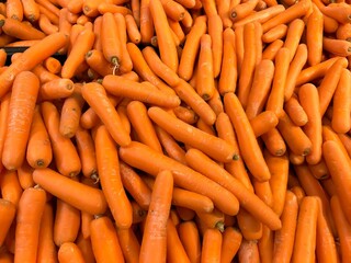 Heap of fresh orange carrots.