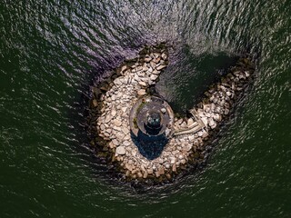 Aerial view of the Orient Point lighthouse out on Long Island, New York on a sunny day