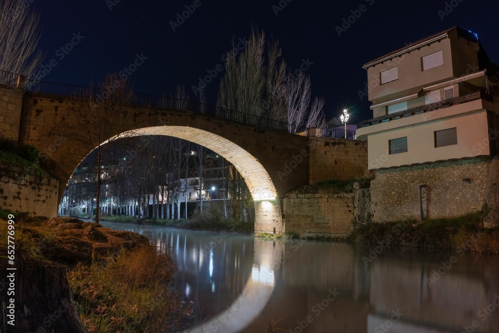 Poster Roman bridge in the town of Trillo at night. Guadalajara. Spain