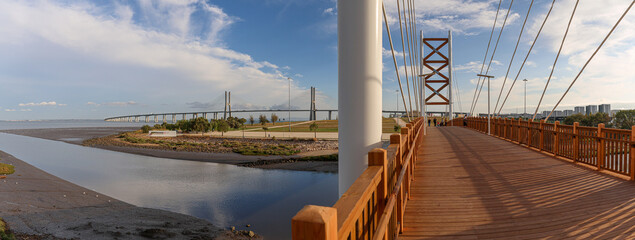 Panoramic landscape over the new bridge over the Trancão River and the Vasco da Gama Bridge together between Loures and Lisbon, Portugal