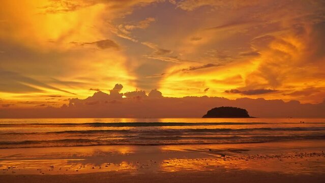 .Amazing beautiful golden sunset above the ocean..cloud moving in nature cloudscape sky of sunset over the sea..Scene of Colorful romantic sky sunset with gold color of the sky background..