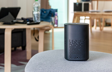 Smart speaker device sits on table in living room for Smart home
