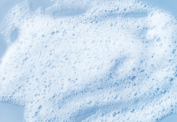 White skincare cleansing foam on light blue background - obrazy, fototapety, plakaty