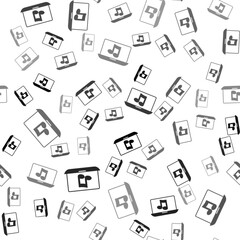 Black Laptop with music note symbol on screen icon isolated seamless pattern on white background. Vector
