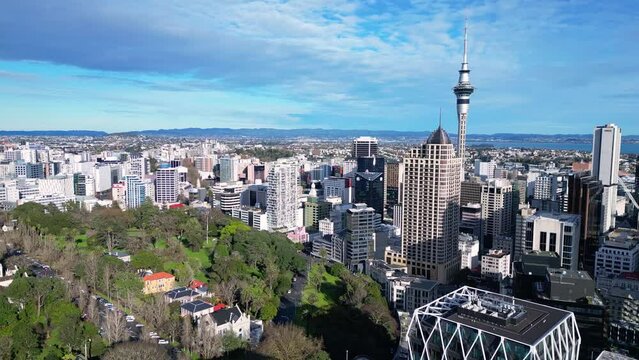 Auckland, New Zealand: Aerial drone footage of Auckland downtown district skyline and the Albert park in New Zealand largest city, shot with a rotation motion. 
