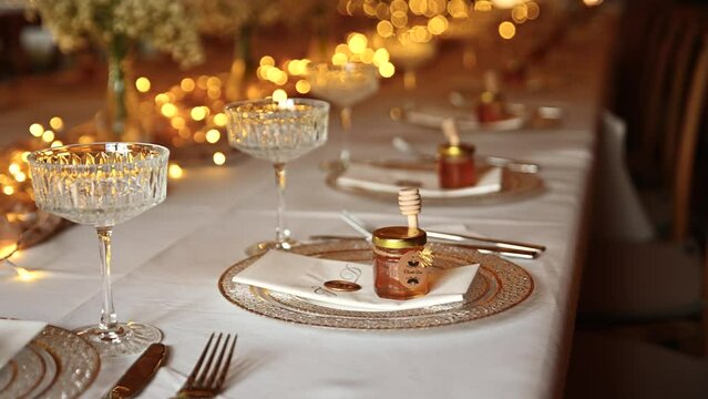 elegant wedding table setting. The festive table is decorated with decorations and ice garlands and beautiful table settings.