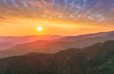 summer scenery mountain view from a highland hill to a beautiful sunset.