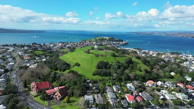 Auckland, New Zealand: Aerial drone footage of the Mount Victoria in Davenport residential district with the Summit hill in the background in New Zealand largest city. 