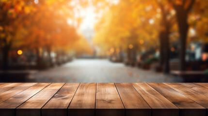 Naklejka na ściany i meble Empty wooden table top with blur background of city street in autumn