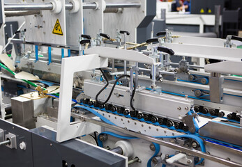 Production of automatic box folder gluer machine for box or carton packaging. Printing industry	 - obrazy, fototapety, plakaty