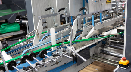 Production of automatic box folder gluer machine for box or carton packaging. Printing industry	