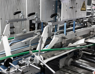 Production of automatic box folder gluer machine for box or carton packaging. Printing industry	