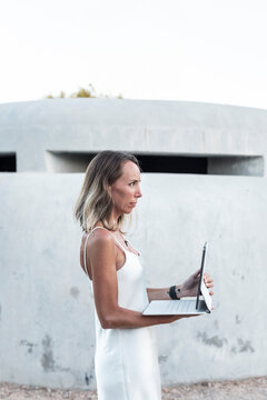 Woman using digital tablet in park, technology and nature for better life quality