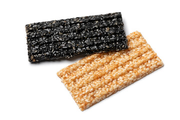 Pair of white and black sesame snaps isolated on white background close up