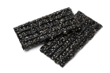 Pair of black sesame snaps isolated on white background close up