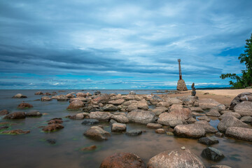 Rocks, lighthouse and the sea