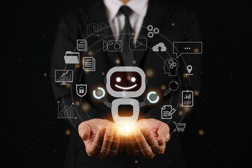 Man shows a robot with many icons around it on his hands, the concept of using artificial intelligence to help to create and solve problems, innovations to use AI with maximum efficiency.