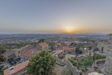 Fototapeta premium View over deserted historic town of Monsant in Portugal during sunrise