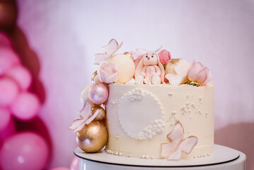 Birthday cake for 1, 2, 3 old year. Cake is decorated with rabbit figure, butterfly, flowers,...