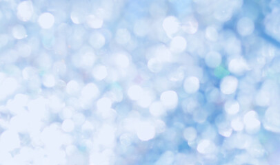 Festive glitter blurred shining blue background with bokeh and highlights.	