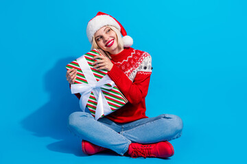 Full length photo of dreamy shiny woman santa elf wear ornament pullover getting x-mas gifts empty...