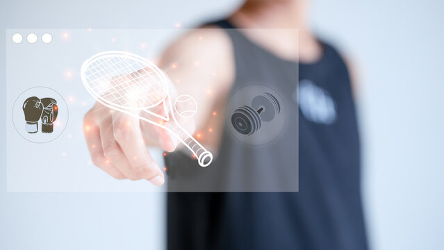 male hand, pointing at a virtual reality hologram image, choosing an exercise program, going to a tennis racket, exercise concept, to keep polite.