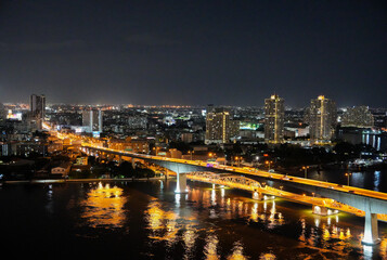 Fototapeta na wymiar The Chao Phraya River and the Cityscape of Bangkok in Thailand Asia