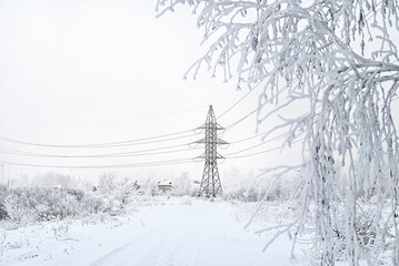 Power lines in the winter forest.Power lines in the winter forest. Power outages due to severe...