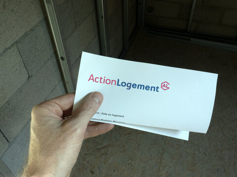 September 26th 2023. A tenant of apartment receives a letter from ActionLogement. Someone opening a letter of the French aid Action Logement.	