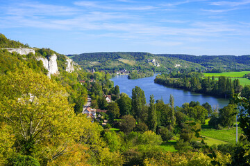 Fototapeta na wymiar Aerial view of the River Seine in the Norman town of Les Andelys, overlooked by the ruins of Château Gaillard, a medieval castle built by the King of England Richard the Lionheart in Normandy, France
