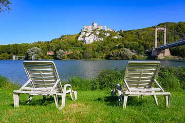 Lounge chairs offering a view over the ruins of Château Gaillard, a French medieval castle sitting on top of limestone cliffs across the River Seine in Normandy