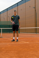 Obraz premium young tennis player coach hitting the ball with a racket on the tennis court preparing for the competition sports lifestyle