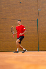 portrait of a young professional tennis player rejoices at the victory at the tournament competition on the open court winner sport game