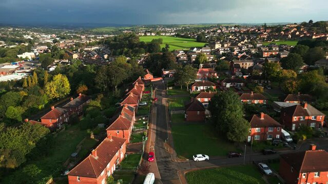 A drone's-eye view captures Dewsbury Moore Council estate's fame, a typical UK urban council-owned housing development with red-brick terraced homes and the industrial Yorkshire