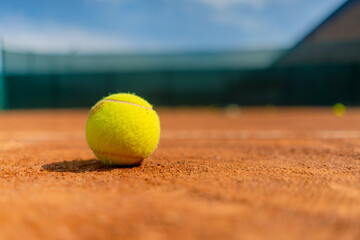 close-up sports equipment a small ball lies on an open ground orange court hobby competition sport