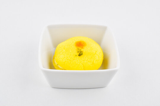 Chamcham sweet in bowl on white background