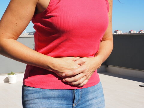 woman with stomach ache or abdominal pain