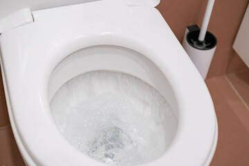 flushing water in toilet to demonstrate personal hygiene act, process of flushing water, clean and...