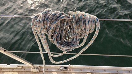 A rope made fast to a wire on sailing boat with cow's hitch