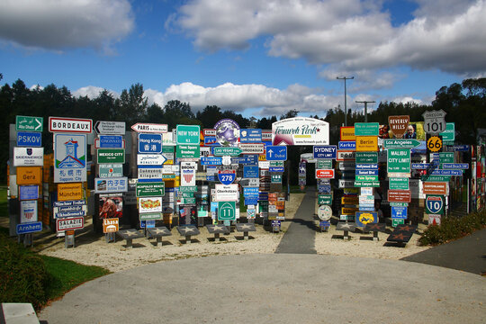 Oberkotzau, Germany - September 23, 2023: Fernweh (Wanderlust) park, a collection of signs from places all over the world. The project by filmmaker Klaus Beer against xenophobia and racism.