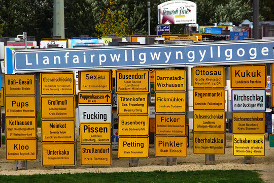 Oberkotzau, Germany - September 23, 2023: Fernweh (Wanderlust) park, a collection of signs from places all over the world. The project by filmmaker Klaus Beer against xenophobia and racism.