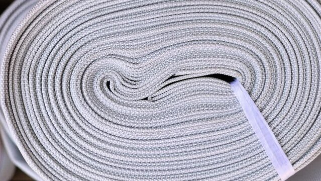 flexible lay flat hose for outdoor lawn or garden watering,polyester  expandable for car washing cleaning pool. outside market shop store, red and white colors 4k