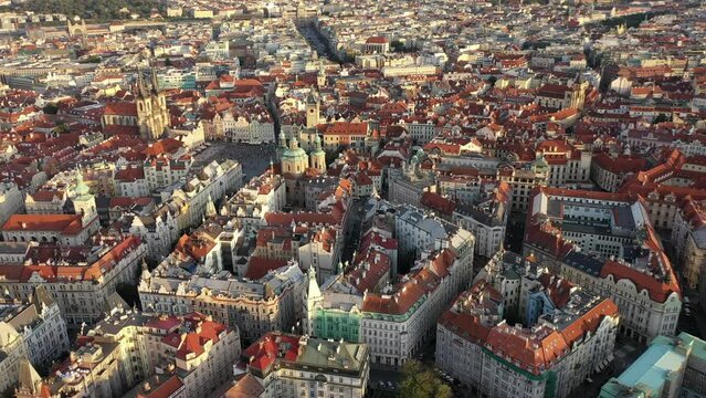 Sunny aerial drone view above Prague Old Town Square. Czech Republic. Summer. Sunset. Tourist town. City life.