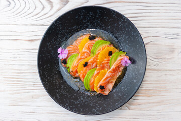 Salmon ceviche with avocado, orange and mango salsa