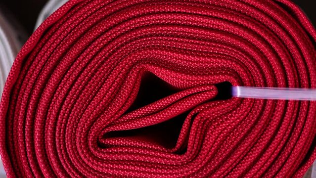 flexible lay flat hose for outdoor lawn or garden watering,polyester  expandable for car washing cleaning pool. outside market shop store, red and white colors 4k