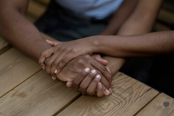 black couple in love hold each other hand, symbol of support trust and empathy